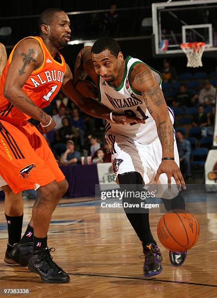 Cheyne Gadson of the Dakota Wizards tries to get a step around Keith McLeod of the Albuquerque Thunderbirds in the second half of their NBA D-League...