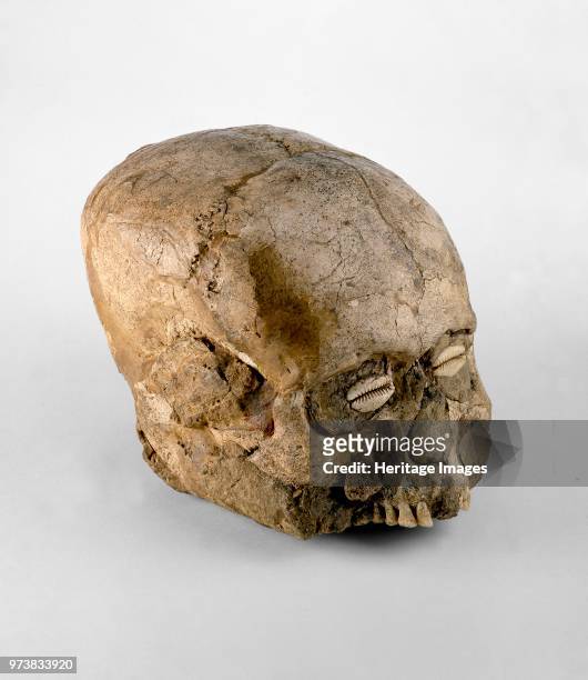 Skull , Pre-pottery Neolithic B . Portrait skull, the eye sockets, cheeks and base of the skull being made up with clay, on which no trace of a...