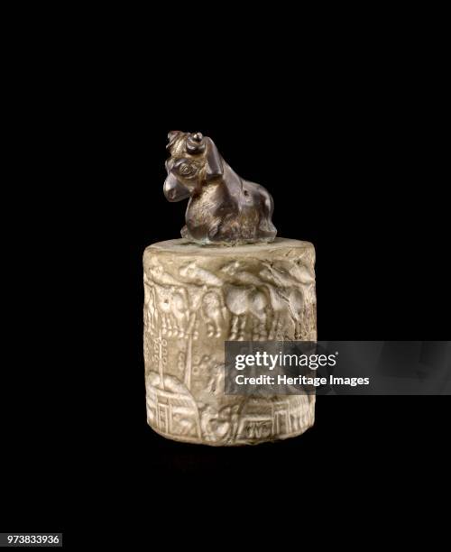 Seal, Late Uruk period, 4000 to 3100 BC. Handled cylinder seal with a scene of pastoral wealth in the marshes of souther Iraq; upper scene: herd of...