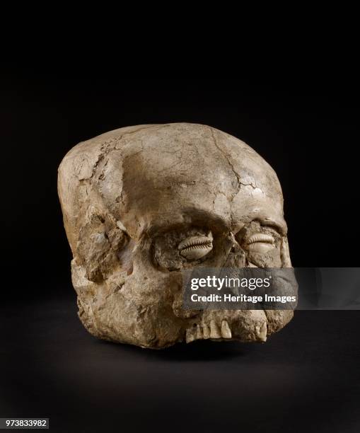 Skull , Pre-pottery Neolithic B, 7300-6300 BC. Portrait skull, the eye sockets, cheeks and base of the skull being made up with clay, on which no...