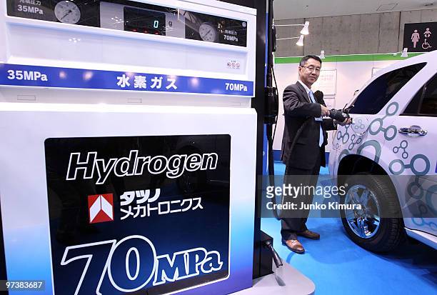 Car and its charger are on display during the 6th International Hydrogen & Fuel Cell Expo at Tokyo Big Sight on March 3, 2010 in Tokyo, Japan. Clean...
