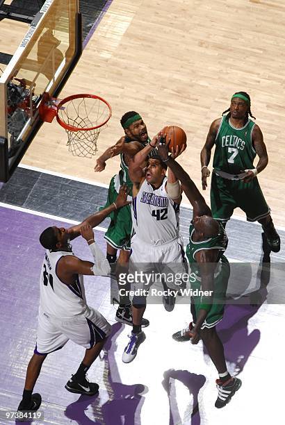 Sean May of the Sacramento Kings gets blocked by Kevin Garnett of the Boston Celtics during the game at Arco Arena on February 16, 2010 in...
