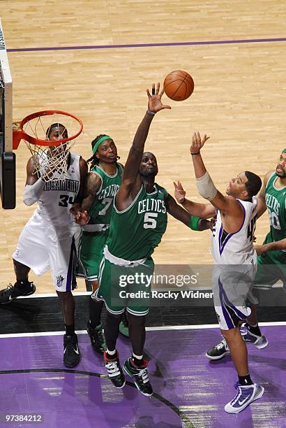 Kevin Garnett of the Boston Celtics goes up in an attempt to block a shot by Sean May of the Sacramento Kings during the game at Arco Arena on...