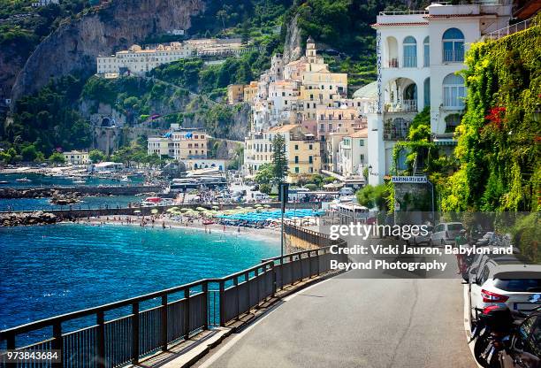 driving into the village of amalfi on the amalfi coast of italy - positano italy stock pictures, royalty-free photos & images