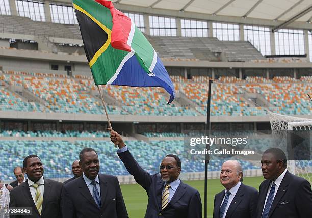Deputy President Kgalema Motlanthe waves the South African flag at the Moses Mabhida stadium, 100 days ahead of the FIFA 2010 World Cup on March 2,...