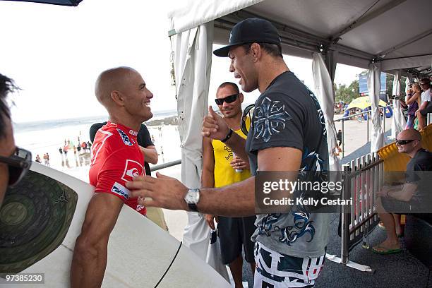 Kelly Slater of the United States is congratuled by UFC legend Antonio Nogueira after winning his Round 3 heat while competing in the Quiksilver Pro...