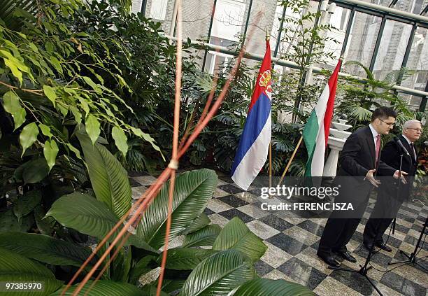 Serbian Foreign Minister Vuk Jeremic answers with his Hungarian counterpart Peter Balazs during a press conference after their meeting in the winter...