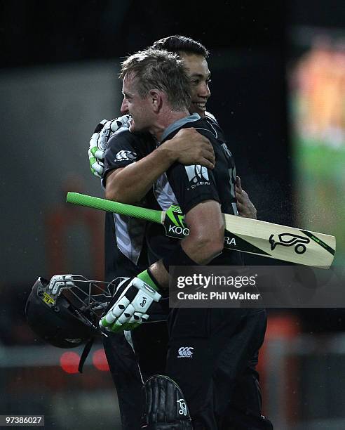 Scott Styris of New Zealand hugs Ross Taylor following the First One Day International match between New Zealand and Australia at McLean Park on...