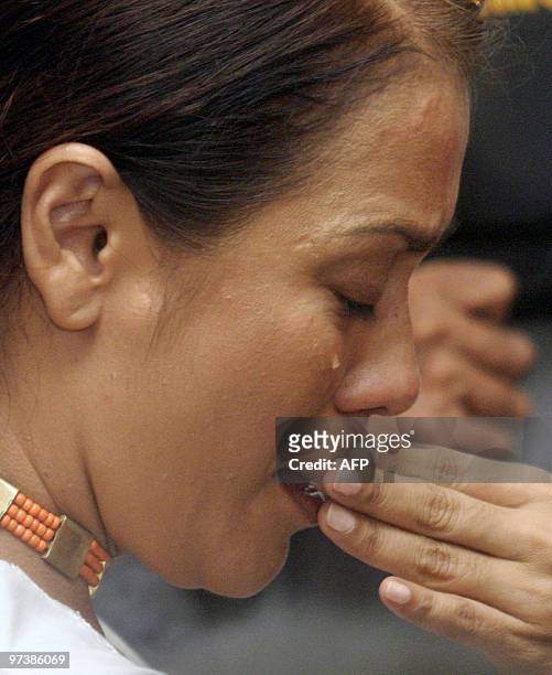 Accused Australian national Angelita Pires cries after an East Timorese court in Dili cleared her on March 3, 2010 over the attempted assassination...