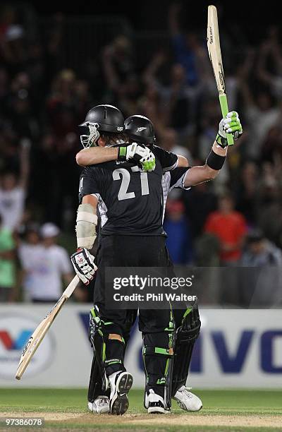 Scott Styris of New Zealand hugs Shane Bond after hitting the winning runs during the First One Day International match between New Zealand and...