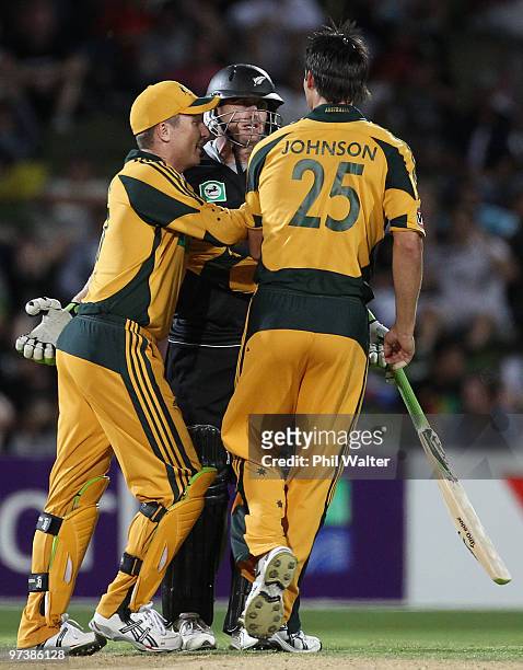 Brad Haddin runs in to seperate Scott Styris of New Zealand and Mitchell Johnson of Australia during an exchange of words during the First One Day...
