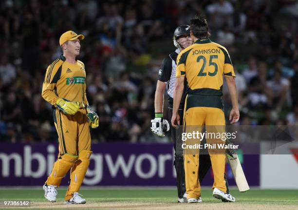 Brad Haddin runs in to seperate Scott Styris of New Zealand and Mitchell Johnson of Australia during an exchange of words during the First One Day...