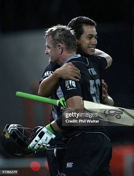 Scott Styris of New Zealand hugs Ross Taylor following the First One Day International match between New Zealand and Australia at McLean Park on...