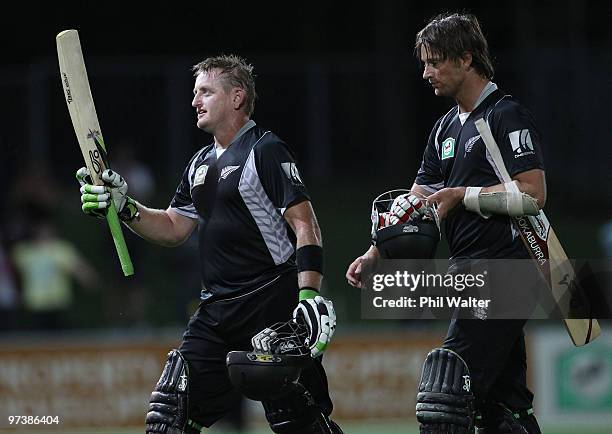 Scott Styris and Shane Bond of New Zealand leave the field following the First One Day International match between New Zealand and Australia at...