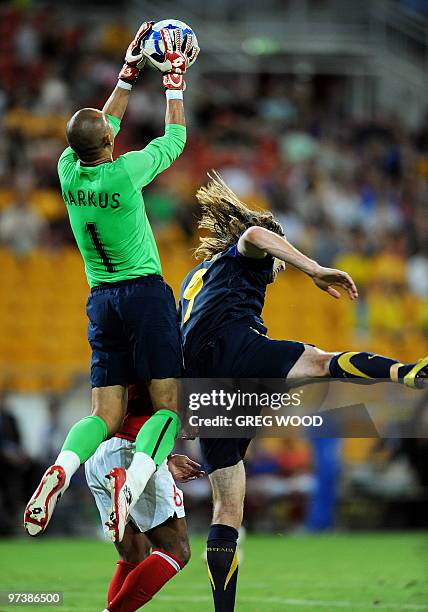 Indonesian goalkeeper Markus Rihihina takes the ball over Australia's Josh Kennedy during their Asian Cup 2011 football qualification match in...