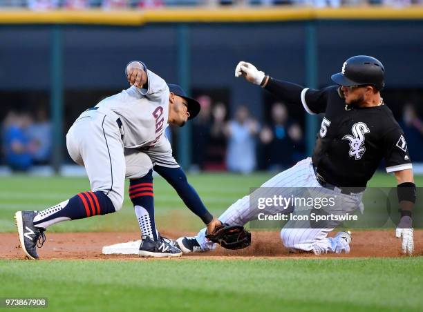 Chicago White Sox second baseman Yolmer Sanchez beats the tag from Cleveland Indians shortstop Francisco Lindor to steal second base on June 13, 2018...