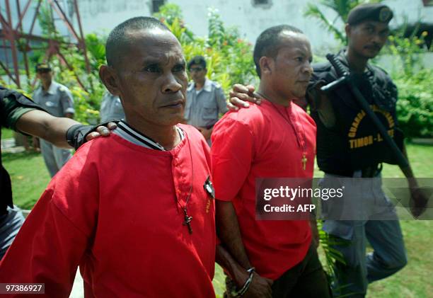 Accused East Timorese rebels are led away from an East Timor courthouse on March 3, 2010 after they were sentenced to 16 years imprisonment over the...