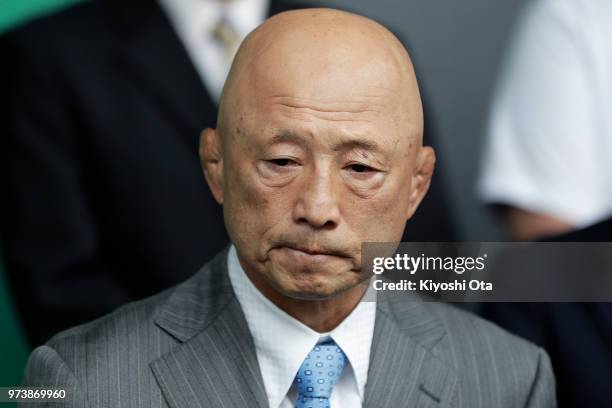 Shigakkan University wrestling team coach and former development director at Japan Wrestling Federation Kazuhito Sakae reacts while speaking to...