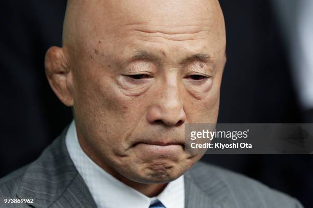 Shigakkan University wrestling team coach and former development director at Japan Wrestling Federation Kazuhito Sakae reacts while speaking to...