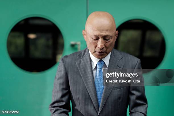 Shigakkan University wrestling team coach and former development director at Japan Wrestling Federation Kazuhito Sakae reacts while speaking to...