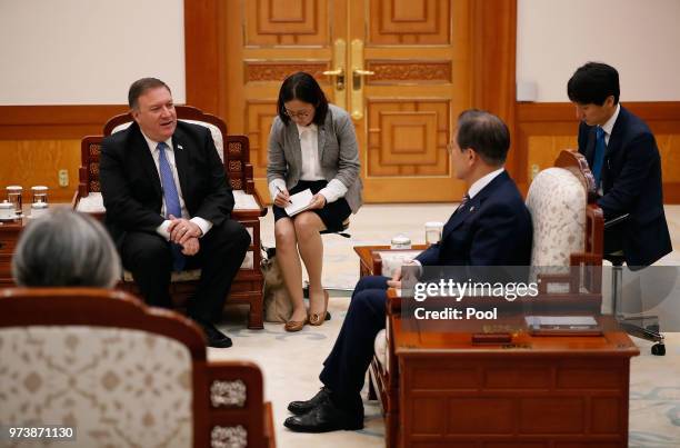 South Korean President Moon Jae-in talks with U.S. Secretary of State Mike Pompeo during their meeting at the presidential blue house June 14, 2018...