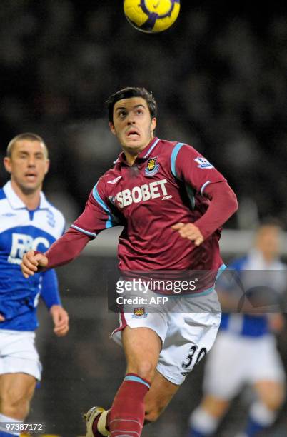 West Ham's English defender James Tomkins in action during the English Premier League football match between West Ham United and Birmingham City at...