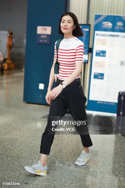 Fashion model Liu Wen is seen at Shanghai Hongqiao International Airport on June 13, 2018 in Shanghai, China.