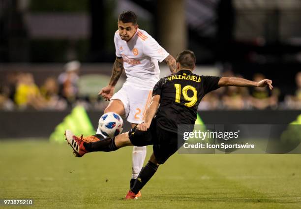 Atlanta United FC defender Franco Escobar just gets the ball over Columbus Crew SC defender Milton Valenzuela in the MLS regular season game between...