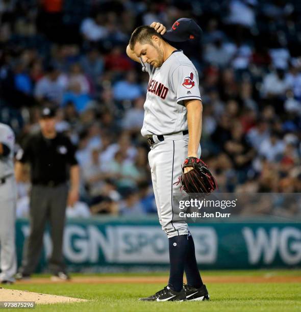 Trevor Bauer of the Cleveland Indians reacts after hitting Tim Anderson of the Chicago White Sox with a pitch during the fifth inning at Guaranteed...