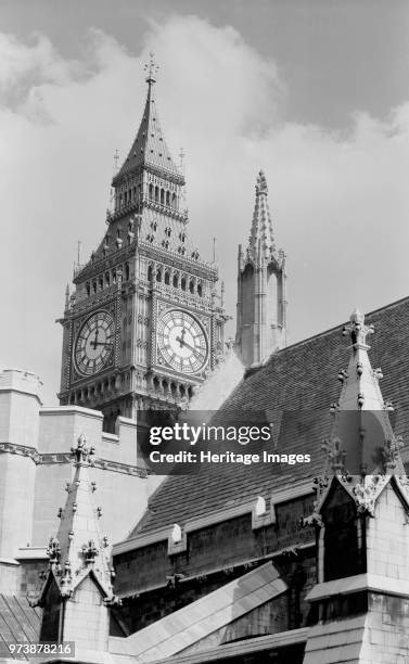 Palace of Westminster, Greater London. General view of the Houses of Parliament showing the clock tower 'Big Ben' and roofs. The clock face shows...