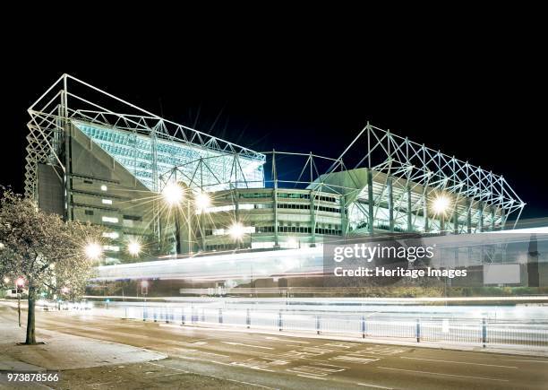 St. James's Park, Newcastle-upon-Tyne, circa 1998-circa 2017. View of the home of Newcastle United Football Club at night. The stark lighting helps...