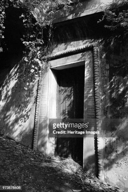 Entrance to a catacomb, Highgate Cemetery, Hampstead, London, 1991. The entrance to a family catacomb in Egyptian Avenue in the West Cemetery. Artist...