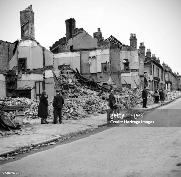 Wartime bomb damage, Highgate Road, Sparkbrook, Birmingham, West Midlands, 29 July 1942. Artist James Nelson.