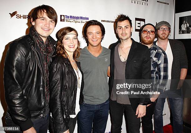 Actor Michael Welch poses with Jason Bynum, Pap Shirock, Chuck Shirock, Derek Blank and Adam Gatchel of Rock band Shirock as they arrive at the...