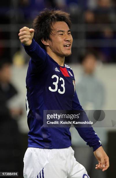 Shinji Okazaki of Japan celebrates after scoring his team's first goal during the AFC Asian Cup Qatar 2011 Group A qualifier football match between...