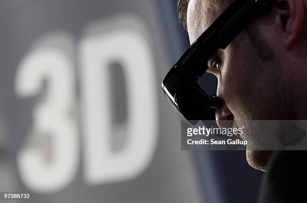 Visitor tries out the Cinemizer Plus 3D video glasses at the Carl Zeiss stand at the CeBIT Technology Fair on March 3, 2010 in Hannover, Germany....
