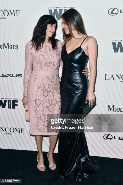 Michaela Watkins and Lake Bell, wearing Max Mara, attend the Women In Film 2018 Crystal + Lucy Awards presented by Max Mara, Lancôme and Lexus at The...