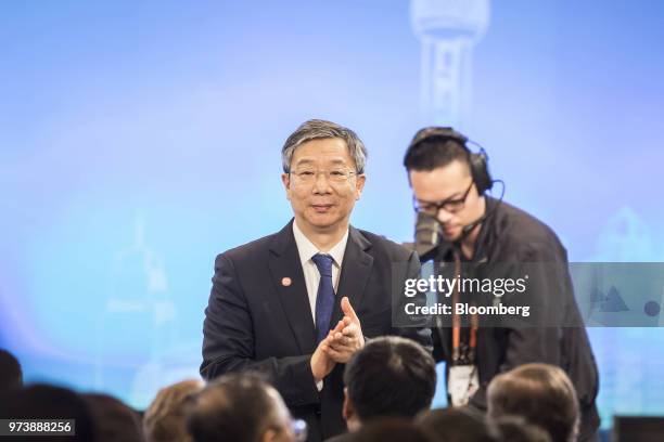 Yi Gang, governor of the People's Bank of China , stands during his introduction at the Lujiazui Forum in Shanghai, China, on Thursday, June 14,...