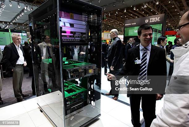 Visitors look at an Enterprise Linux Server at the IBM stand at the CeBIT Technology Fair on March 3, 2010 in Hannover, Germany. CeBIT will be open...