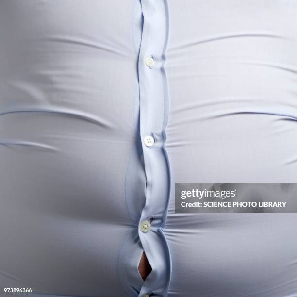 overweight man with bulging shirt buttons - belly button ストックフォトと画像