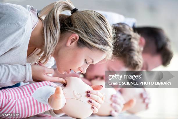 doctors practising infant cpr - chest compression hands stock pictures, royalty-free photos & images