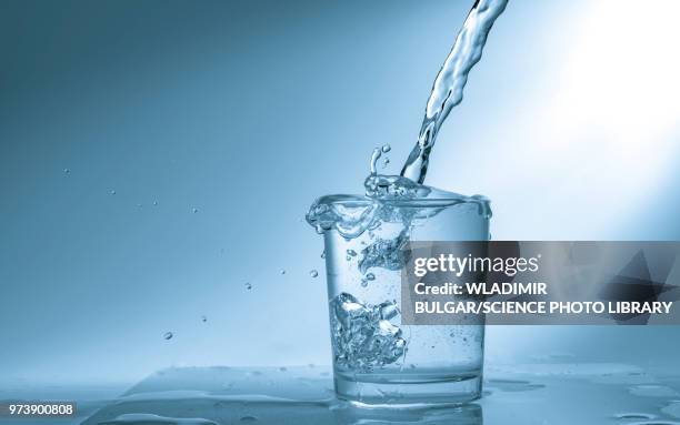 pouring water into glass - glass water foto e immagini stock