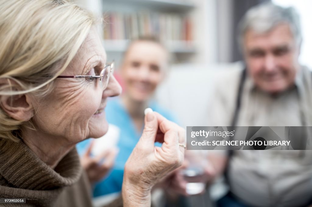 Taskine Tablet Woman Taking Tablet High-Res Stock Photo - Getty Images