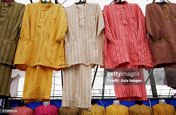 traditional malaysian attire, buju melayu. - baju melayu stock pictures, royalty-free photos & images
