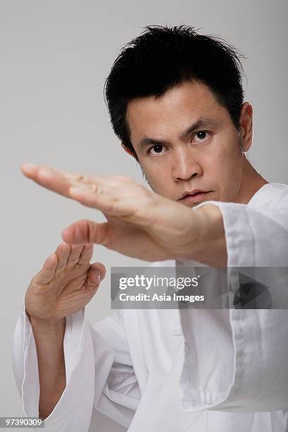 close up of man using martial arts - gidräkt bildbanksfoton och bilder