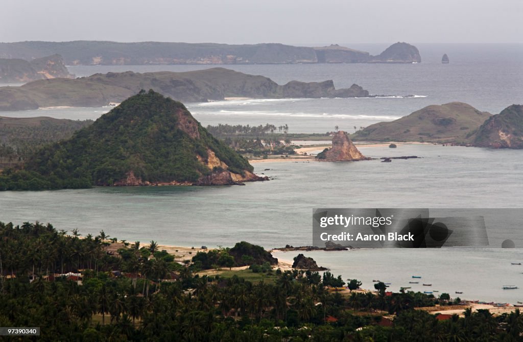 Abrupt green hills above bays and coastline