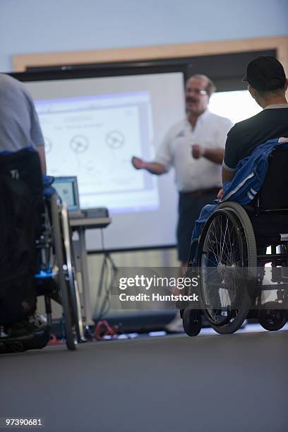 disability sports training class - slide projector stock pictures, royalty-free photos & images