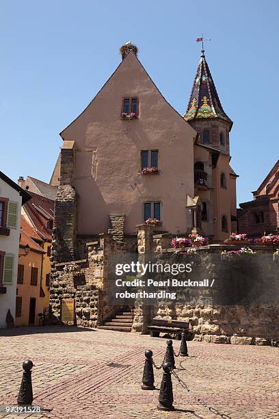 chateau st. leon in medieval village on the wine route, place du chateau, eguisheim, alsace, haut rhin, france, europe - haut rhin stock pictures, royalty-free photos & images