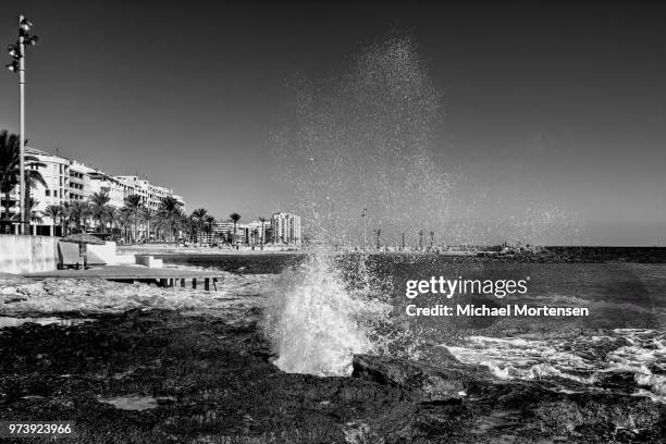 windy rocky-beach - coin fountain stock pictures, royalty-free photos & images