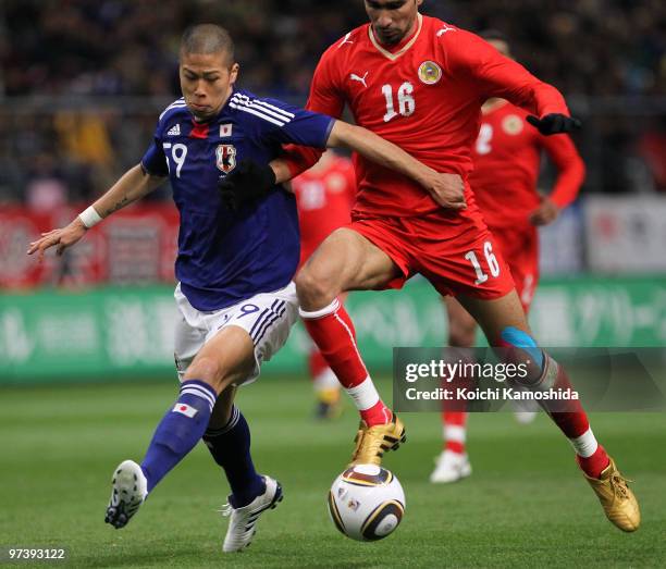 Sayed Mohamed Adnan of Bahrain competes with Takayuki Morimoto of Japan during the AFC Asian Cup Qatar 2011 Group A qualifier football match between...